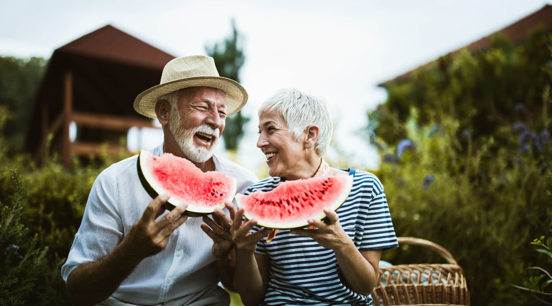a couple eating watermelon